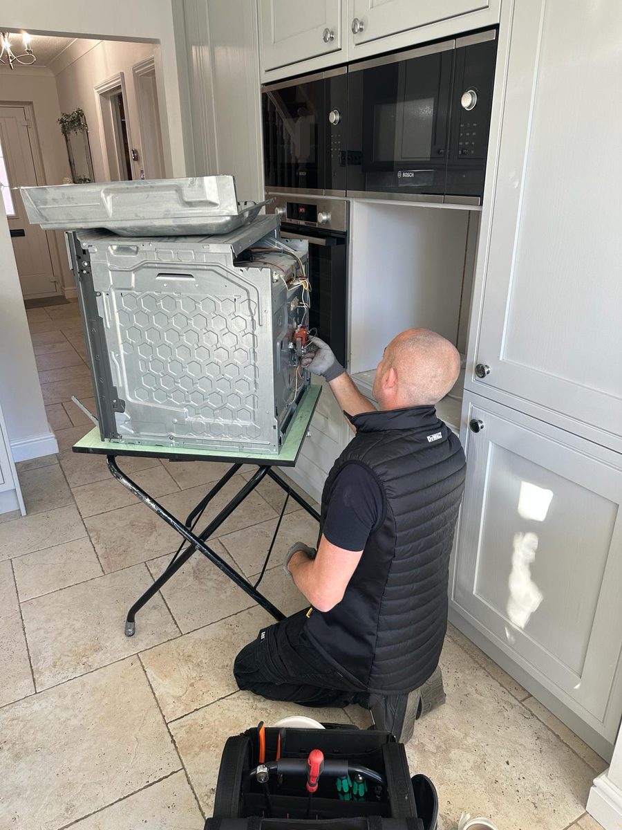 Appliance Academy engineer repairing a built-in Bosch oven